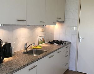 Modern kitchen in Holiday home in Alphen aan den Rijn, fully equipped for a comfortable stay in South Holland.