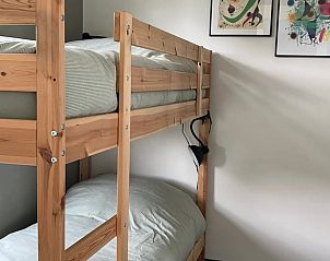 Knusse slaapkamer met stapelbed in Vakantiehuis in Ammerstol, ideaal voor gezinnen.